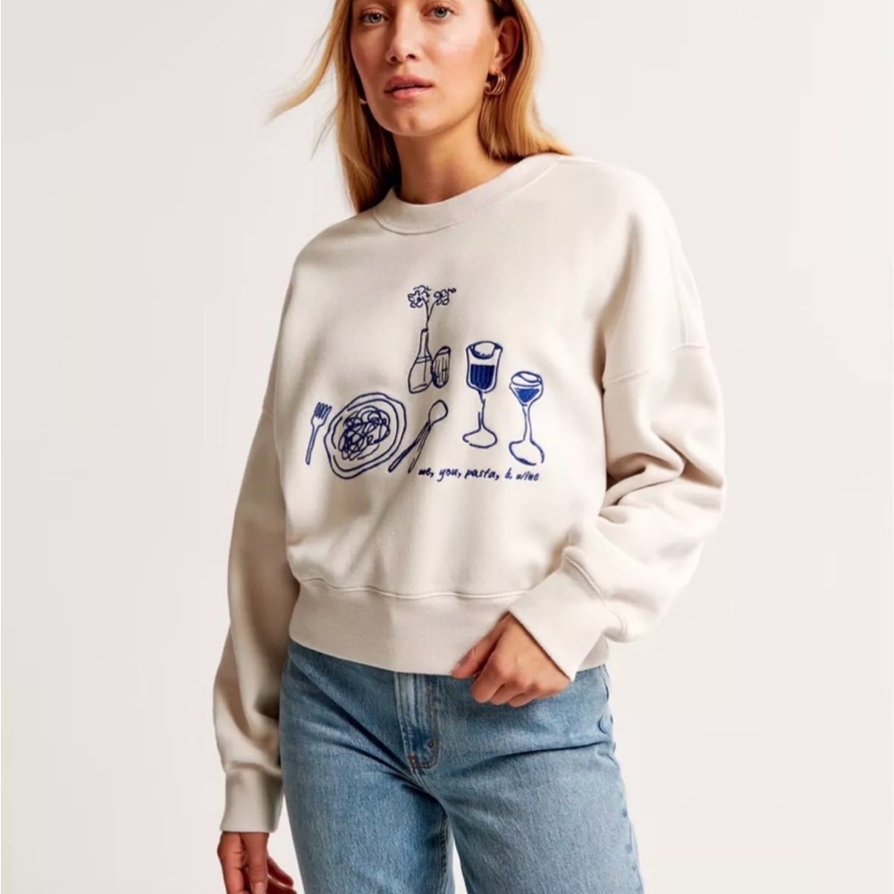 Abercrombie & Fitch Cream pasta and wineSweater with Blue Graphic